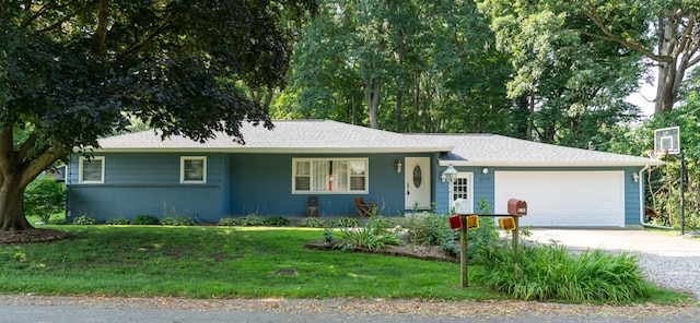 ranch-style home with a garage and a front lawn