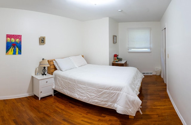 bedroom with wood-type flooring