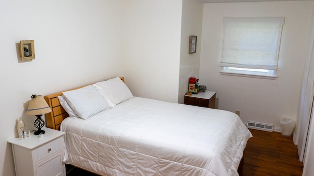 bedroom featuring dark wood-type flooring