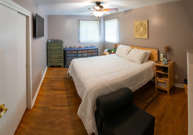 bedroom with ceiling fan and hardwood / wood-style floors