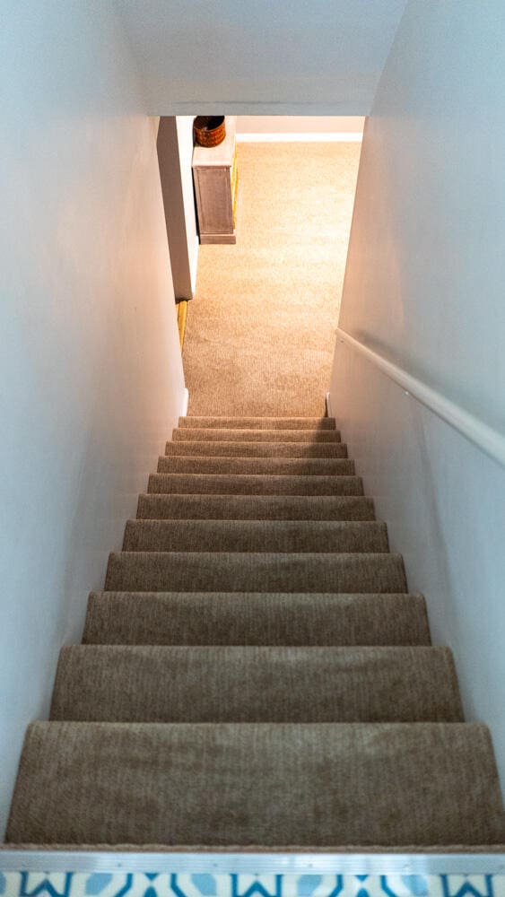 staircase with carpet