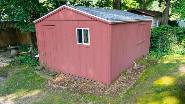 view of outbuilding featuring a yard