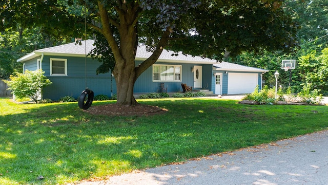 ranch-style home with a garage and a front lawn