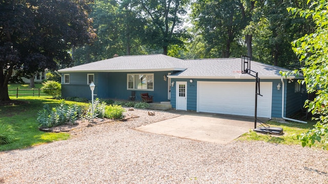 single story home with a garage and a front lawn