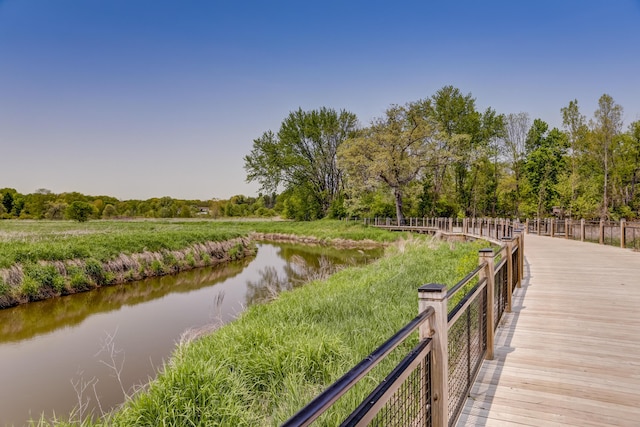 surrounding community with a water view