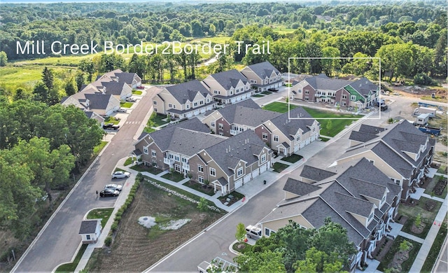 bird's eye view featuring a residential view and a forest view