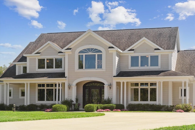 view of front of home featuring a porch and a front yard