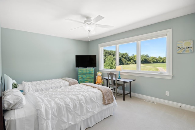 bedroom featuring ceiling fan and light colored carpet