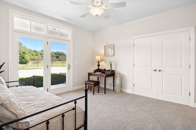 carpeted bedroom featuring ceiling fan, a closet, and access to outside