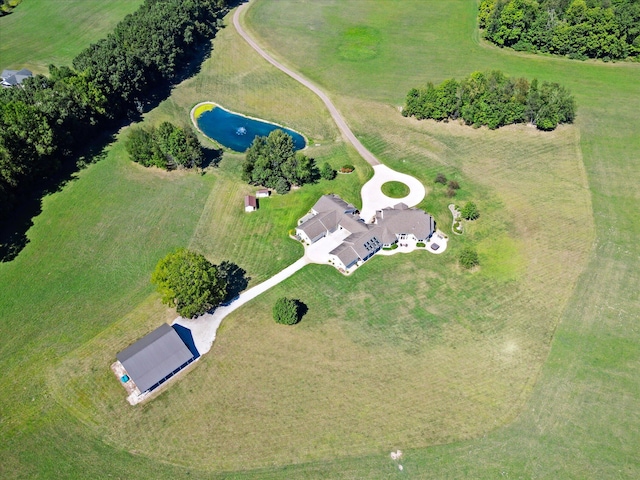 birds eye view of property with a rural view