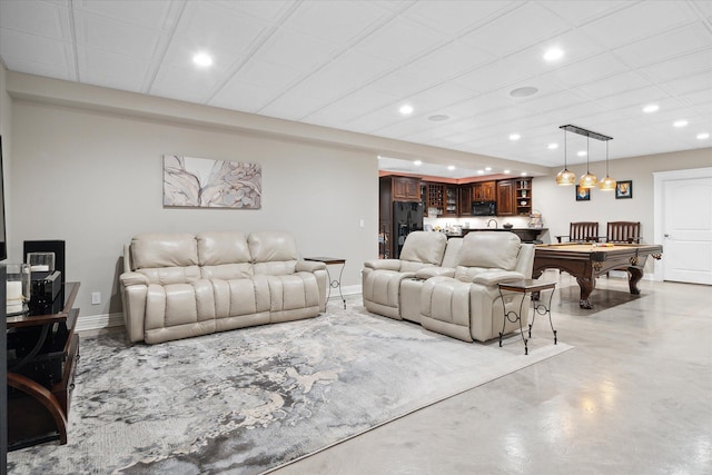 living room with indoor bar and pool table