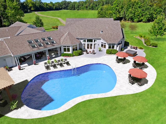 view of pool with a lawn, an outdoor living space, and a patio