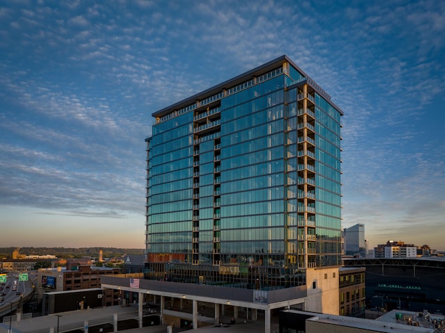 view of outdoor building at dusk