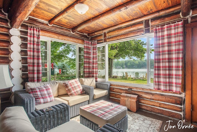 sunroom / solarium featuring beam ceiling, wooden ceiling, and a water view