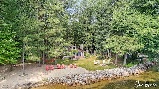 view of yard with an outdoor structure and a water view