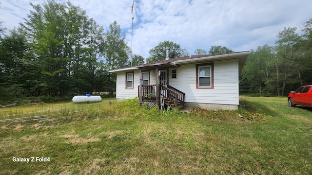 view of front of home with a front yard