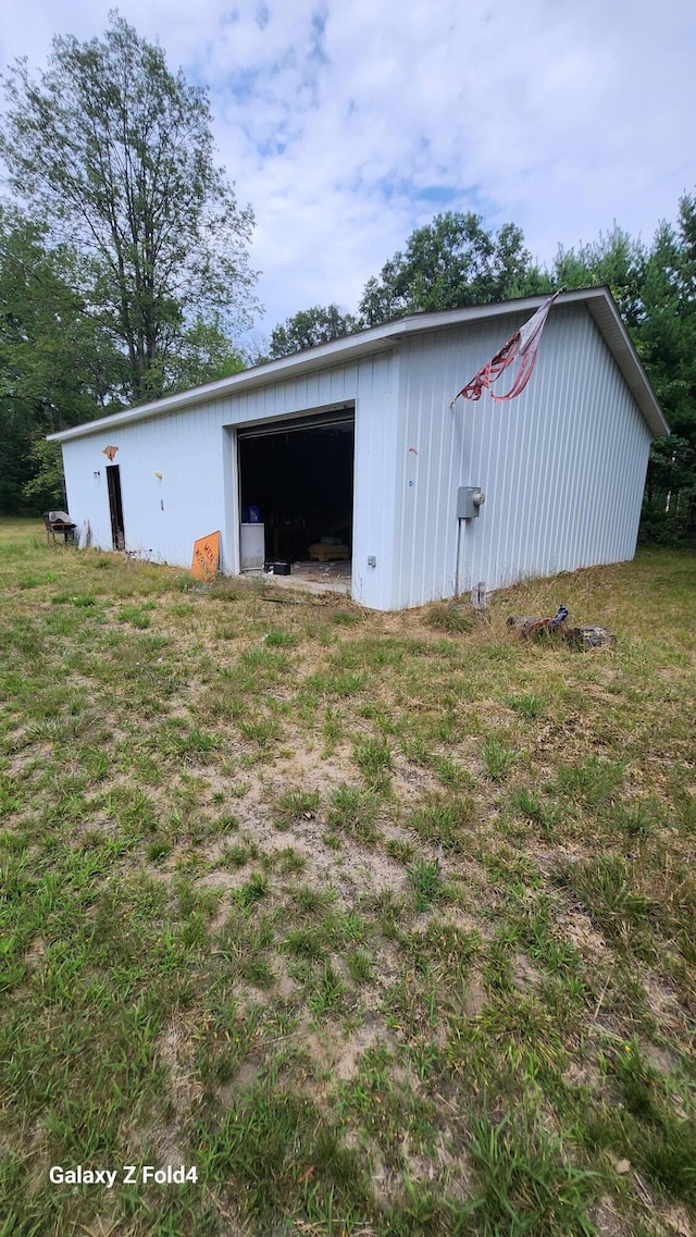 view of outdoor structure with a lawn