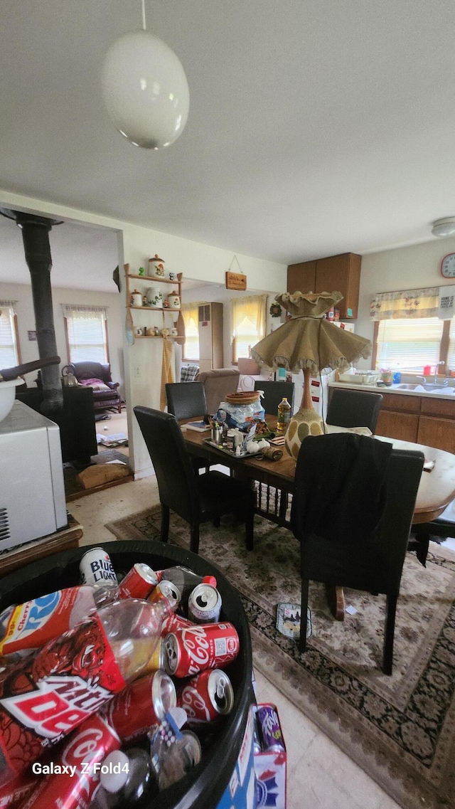 dining area with a wood stove