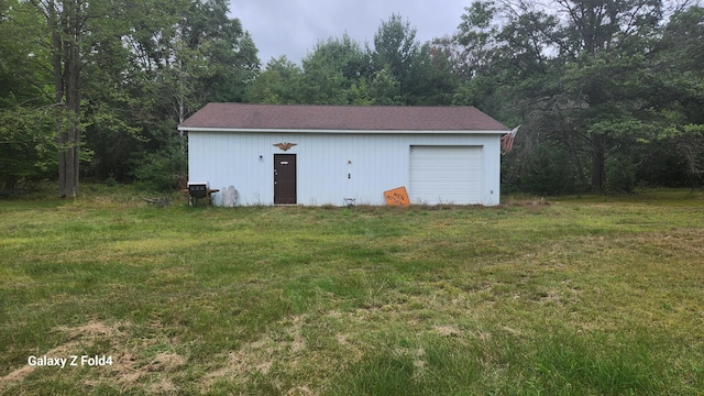 garage featuring a yard