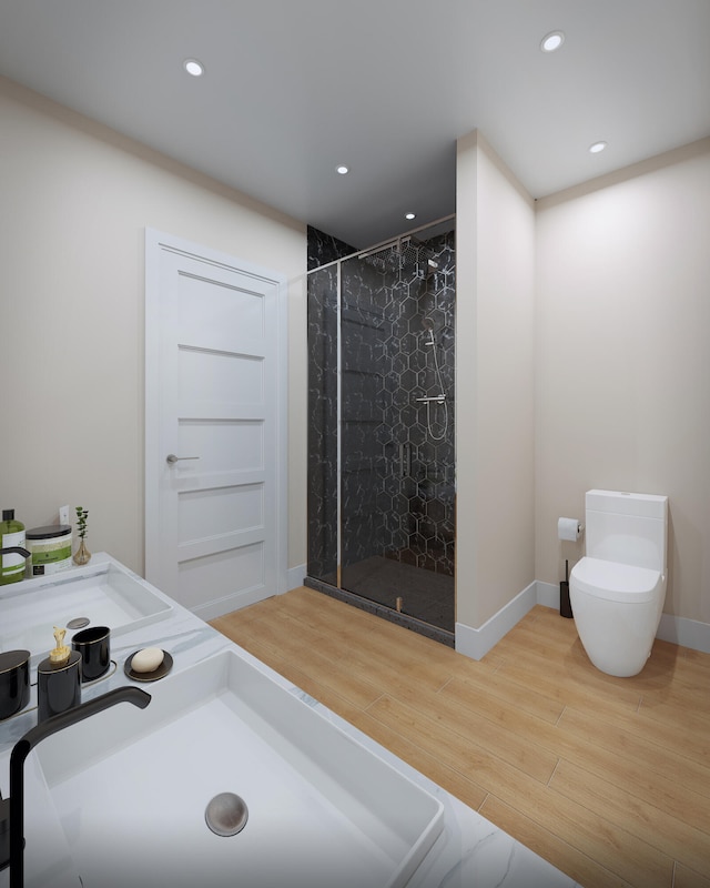 bathroom featuring toilet, an enclosed shower, wood-type flooring, and sink