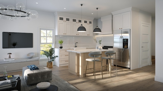 kitchen featuring hardwood / wood-style floors, a center island, backsplash, white cabinets, and stainless steel refrigerator with ice dispenser