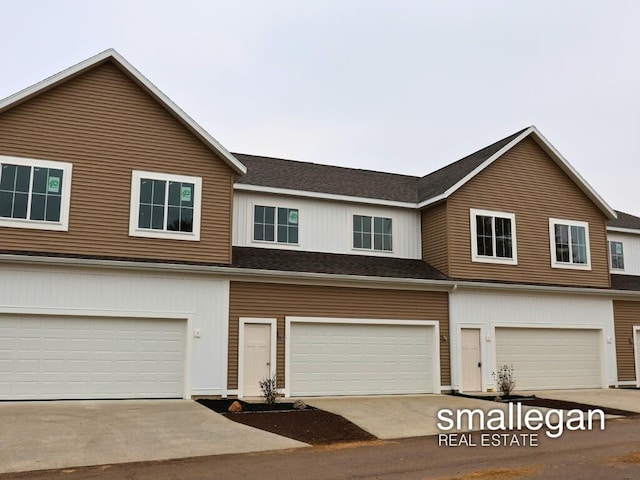 townhome / multi-family property featuring a garage