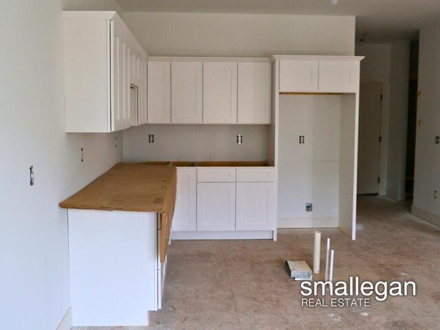 kitchen featuring white cabinets