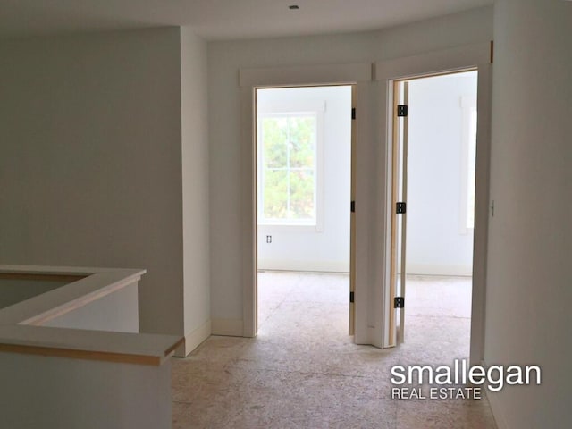 hallway featuring light carpet