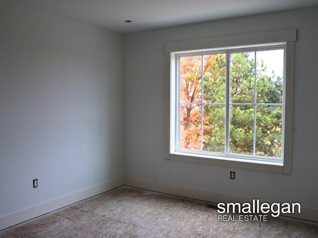 unfurnished room with plenty of natural light