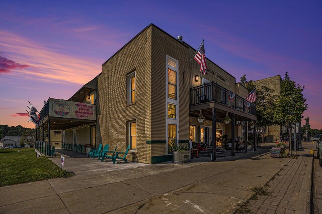 view of outdoor building at dusk