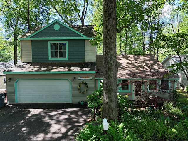 view of front of home with driveway and an attached garage