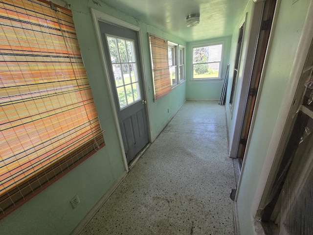 hallway featuring plenty of natural light