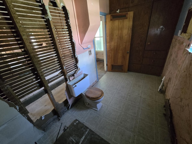 interior space with wooden walls and tile patterned floors