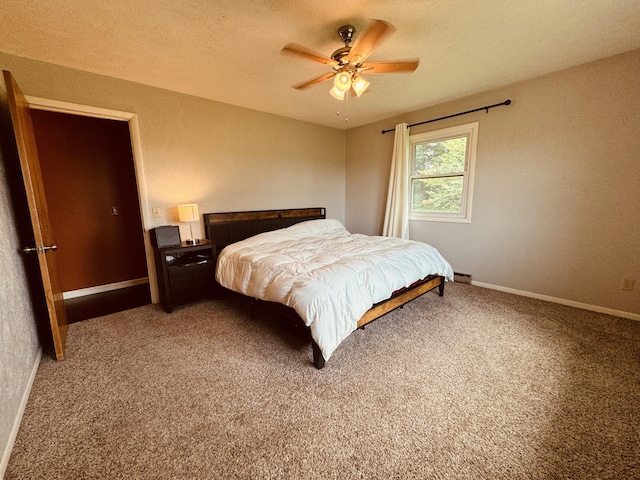 bedroom with ceiling fan and carpet flooring