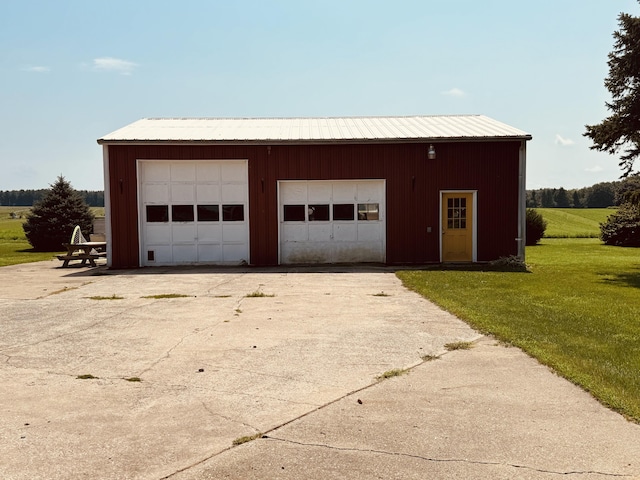 garage with a lawn