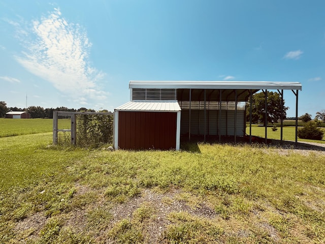 view of outbuilding featuring a lawn