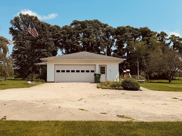 garage featuring a lawn