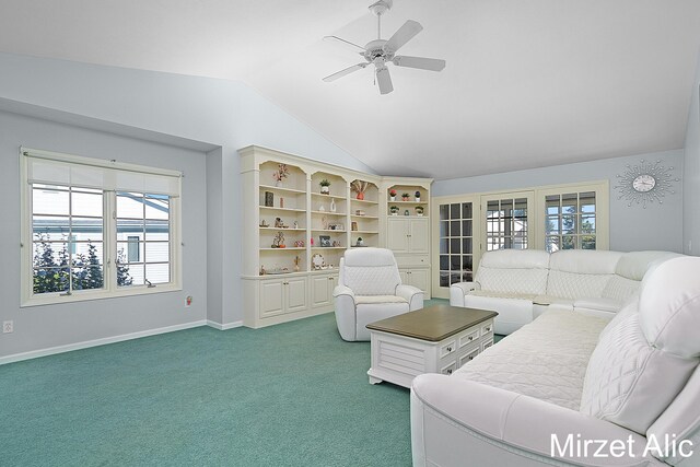 living room featuring lofted ceiling, carpet floors, and ceiling fan