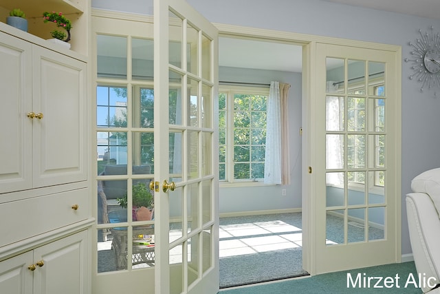 doorway with french doors and carpet floors