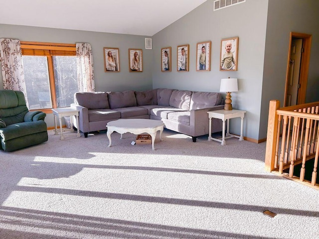 carpeted living room with lofted ceiling