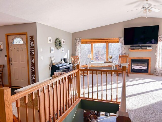 interior space featuring carpet flooring and lofted ceiling