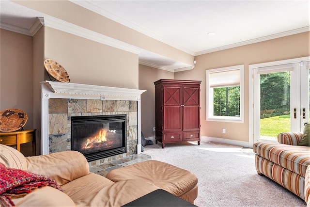 carpeted living room featuring ornamental molding and a tile fireplace