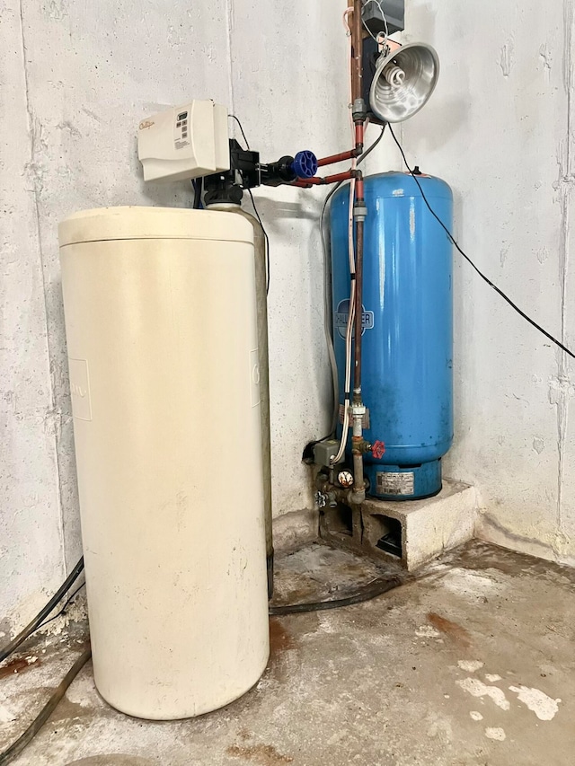 utility room featuring water heater