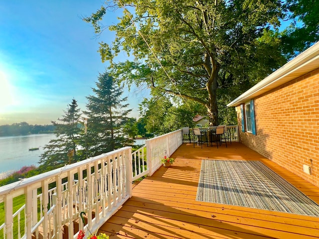 wooden terrace with a water view