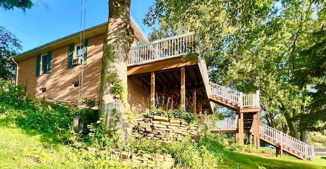 view of side of property with a wooden deck