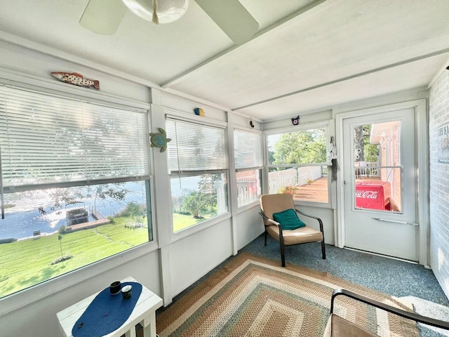 sunroom / solarium with ceiling fan