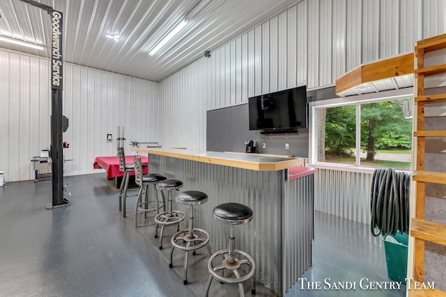 interior space featuring a kitchen bar