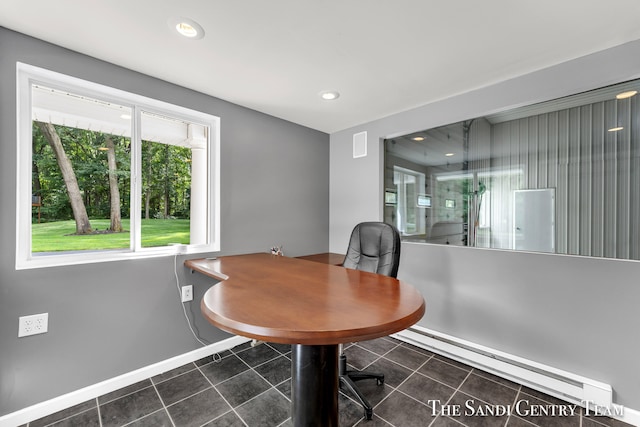 tiled dining room featuring a baseboard radiator