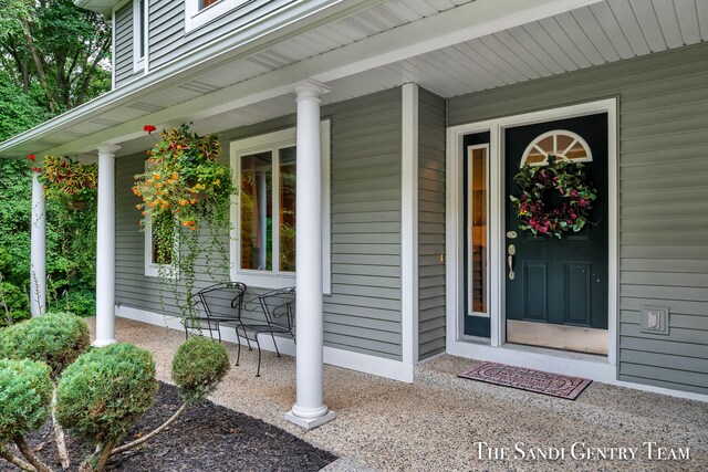 property entrance featuring covered porch