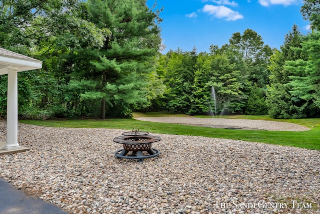 view of yard with an outdoor fire pit